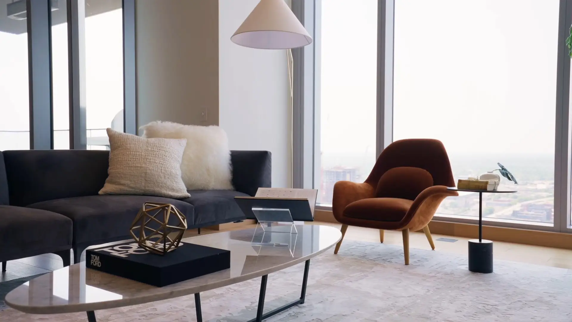 Living room with a sofa, armchair, coffee table and a TV